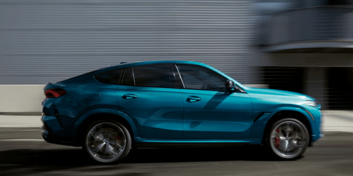 exterior of bmw x6 driving on the road