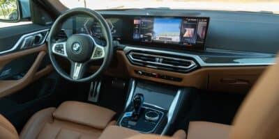 Interior view of the BMW i4 with brown leather and black accents.