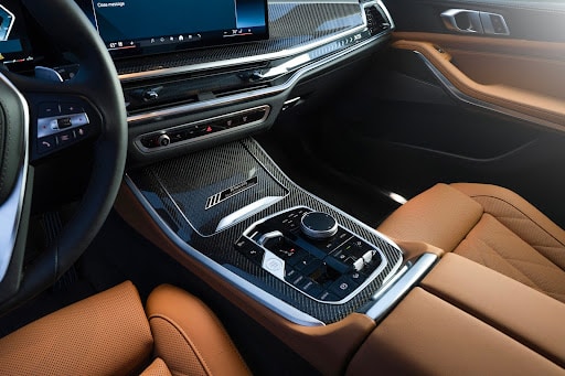 Brown interior of a bmw that has rear cross traffic alert