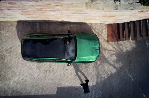 A panoramic view of a green 2025 bmw m5.