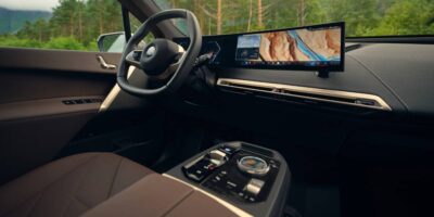 BMW panoramic iDrive interior showing advanced digital dashboard and widescreen display inside a BMW, featuring BMW panoramic iDrive system.